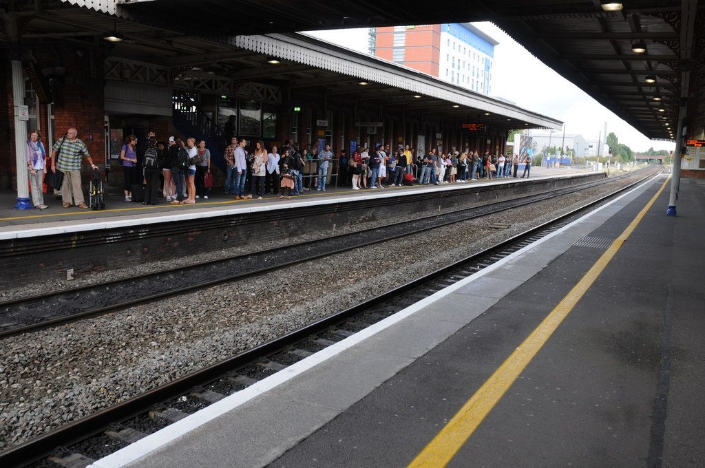 A picture of the platforms at Slough station with passengers waiting for a train